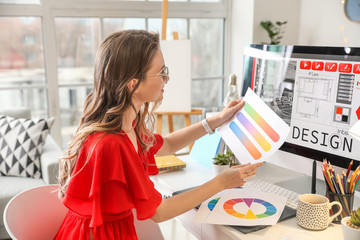 Female interior designer working in office