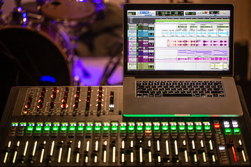 Digital mixer in a recording Studio , with a computer for recording sounds and music. The concept of creativity and show business.