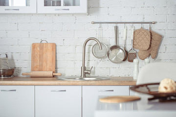 Modern stylish Scandinavian kitchen interior with kitchen accessories.