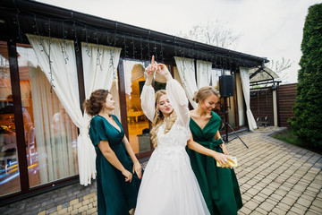 bride having fun with bridesmaids