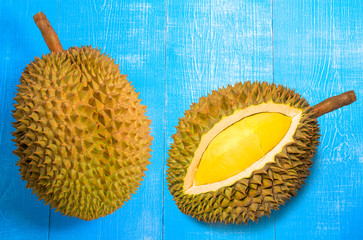 Fresh Durian fruit on blue wood background,Durian fruit with delicious golden yellow soft flesh.