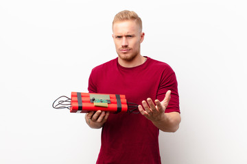 young blonde man looking angry, annoyed and frustrated screaming wtf or what‚Äôs wrong with you...