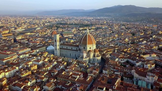 Duomo Cathedral of St. Mary of Fiore and St. John's baptistery on Florence Italy, Aerial circle pan left