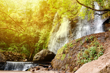 Fototapeta na wymiar Tropical waterfall in deep forest