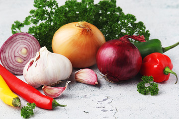 Different spices: onion. garlic, parsley and pepper