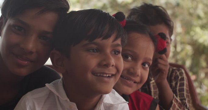 Friends like brothers sisters children together having a good time looking straight at camera as they play and enjoy each other's company and pose for photo video looking adorable, cute mischievous