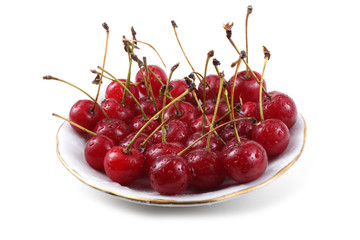 Red cherries on dish