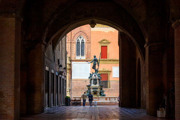 The Fountain of Neptune (Fontana di Nettuno) located in  Piazza del Nettuno in Bologna, Italy. Architecture and landmark of Bologna. Cityscape of Bologna.