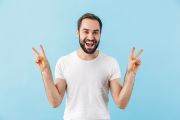 Portrait of a young cheerful bearded man wearing t-shirt