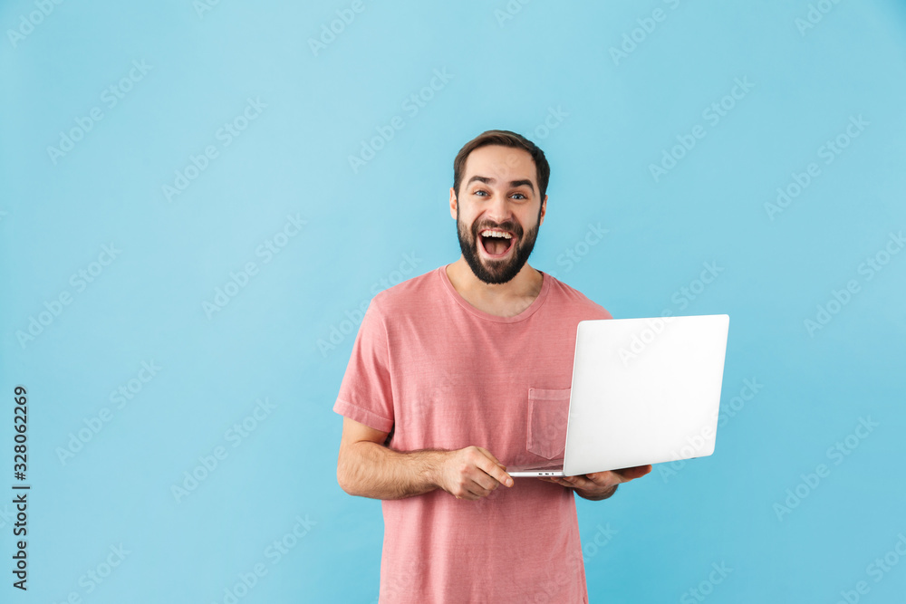 Sticker Portrait of a young cheerful bearded man wearing t-shirt