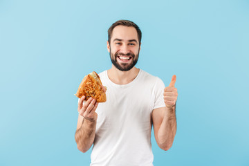 Portrait of a young cheerful bearded man wearing t-shirt