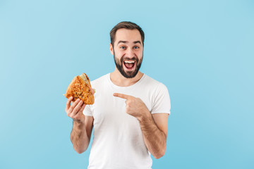 Portrait of a young cheerful bearded man wearing t-shirt