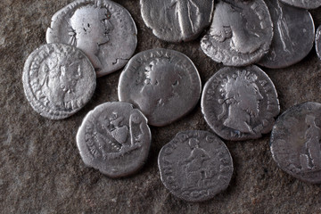 Ancient Roman coins on stone