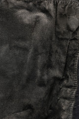 black structural background - old shabby stylish suede, reverse side, old fabric, textile