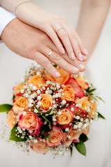 Obraz na płótnie Canvas wedding bouquet in brides hands of bride