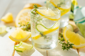 Detox drinks infused water and ingredients on wood background, copy space
