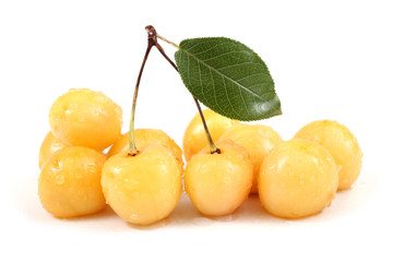 Yellow cherries and leaf