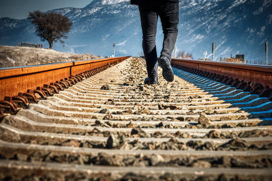 Walking man on a railroad