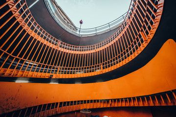 Orange geometric parking garage wide angle