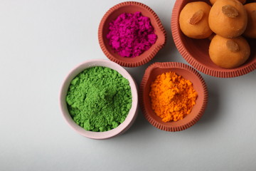 Popular Indian Sweet Besan Laddoo or gram flour sweet balls popular Holi snacks served in earthen bowls. (Holi Food Concept)