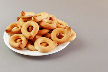 Sweet round crisps lined with flour and sugar on a gray background with space for text
