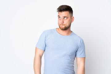 Obraz premium Russian handsome man over isolated background having doubts while looking up