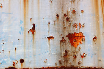 Weathered and rusty old car body