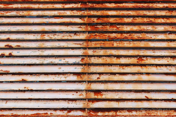 Weathered and rusty old train window