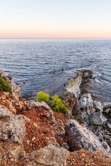 Coast of the Mediterranean sea with orange rocks