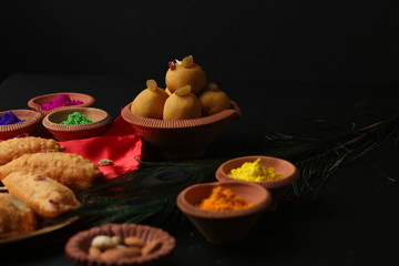 Dahi vada is Indian chaat Fast food of india popular for Holi. served in earthen bowl. Holi food concept