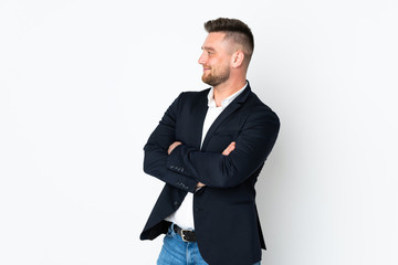 Young Russian business man isolated on white background looking to the side
