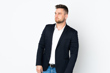 Young Russian business man isolated on white background looking side