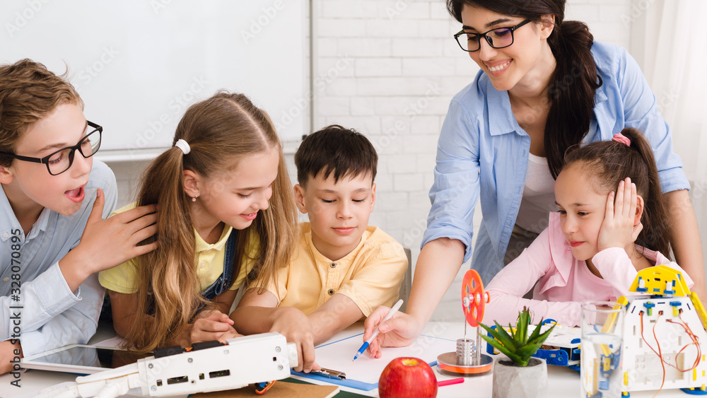 Poster stem education. children studying at robotic class, making notes
