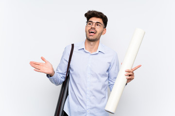 Young architect man over isolated white background with surprise facial expression
