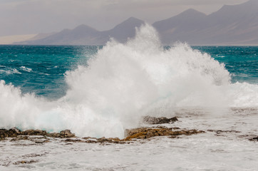 nature poster. wild cost with big waves