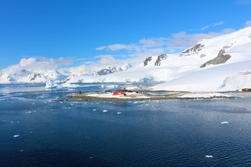 Frozen coasts, icebergs, mountain and the Chilean González Videla Antarctic Base in  Paradise Bay on the Danco Coast, Antarctica