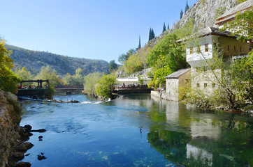 Fototapeta na wymiar Go to Page|Prev123456Next Blagaj Tekija: Bosnia's Beautiful Monastery Under A Cliff. It situated next to the source of the river Buna. The Tekija was first founded during the height of the Ottoma