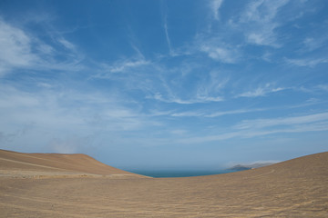 Fototapeta na wymiar Paracas national park. Peru. Ocean and desert. Sand dunes. Coast