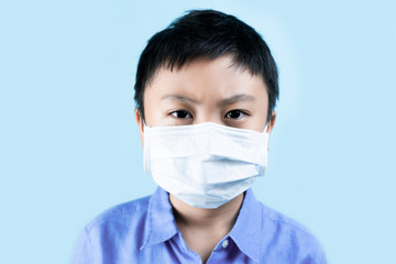 Little boy wearing healthy masks for protect virus