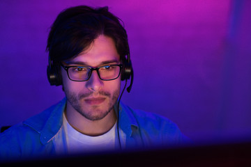 Student Guy At Desktop PC Playing Game Online At Home