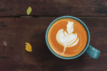 hot latte coffee drink put on wooden table in the morning day