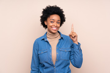 African american woman over isolated background pointing with the index finger a great idea