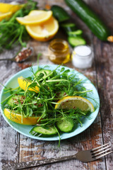 Healthy light salad with microgreens, lemon and cucumber with flax seeds and seeds. Super food. Spring food.