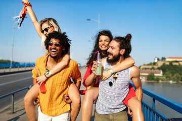 Happy group of friends having fun, travelling and smiling