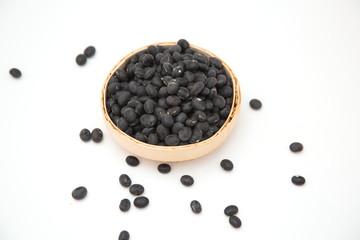 Fototapeta na wymiar A pile of black beans in the bamboo basket
