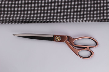 scissors and canvas fabric on a white background