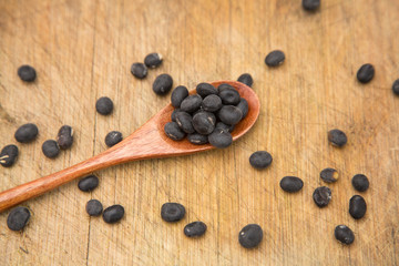 A pile of black beans in the bamboo basket