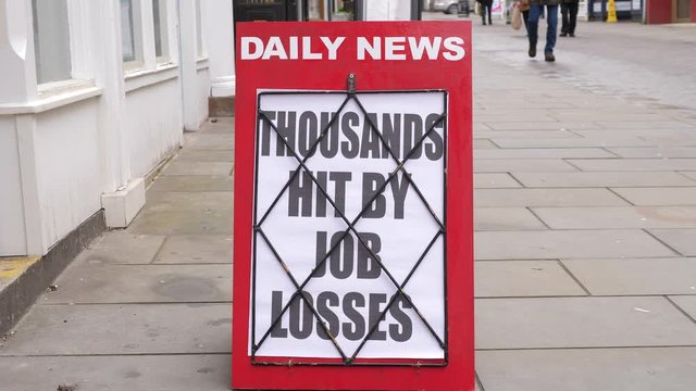 4K: Newspaper Headline Board about Job losses and layoffs, redundancy - News stand. Stock Video Clip Footage