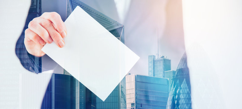 Double exposure image of voter putting ballot into voting box and buildings. Business and election concept. 