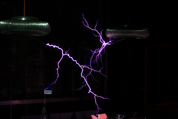 Artificial lightning from Tesla coils over the layout of the city